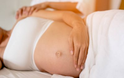 Pregnant women are enjoying a relaxing massage in bed at home. To treat and care for the mental health of the fetus Prenatal and Pregnancy Care Concept of Women